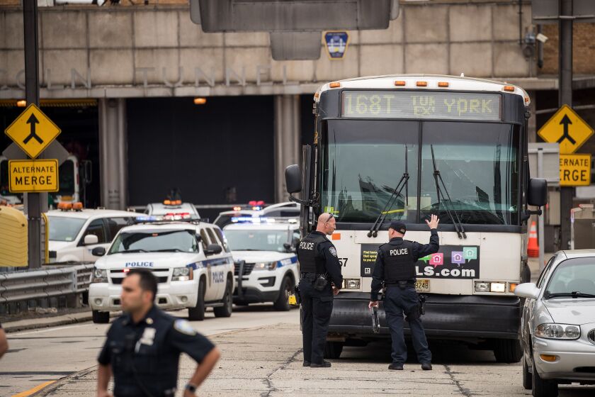 Police from the Port Authority of New York and New Jersey investigate a New Jersey Transit bus that was involved in a morning crash near the Manhattan entrance to the Lincoln Tunnel, May 18, 2018 in New York City. According to officials from the New York