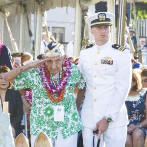 Pearl Harbor survivor, Al Rodrigues salutes for the audience during a ceremony at the Arizona Memorial in Honolulu, Hawaii. | Craig T. Kojima /The Star-Advertiser via AP