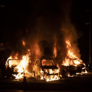 A used car lot is one of several businesses to burn during the second night of unrest after police shot Jacob Blake, Monday night, Aug. 24, 2020.