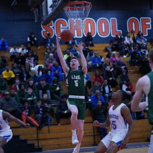 Lane’s Johnny Colombo (5) gets an easy basket against Proviso East, Wednesday 02-27-19. Worsom Robinson/For Sun-Times