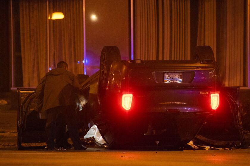 Chicago police investigate a scene where four people were shot Monday morning in the 500 block of South Michigan Avenue. | Tyler LaRiviere/Sun-Times