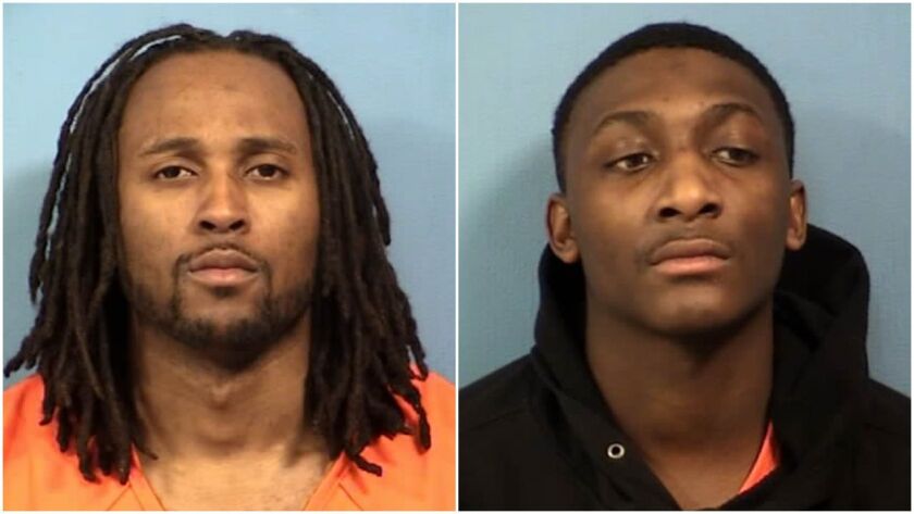 Two men are charged with robbing a Verizon store in Lisle at gunpoint