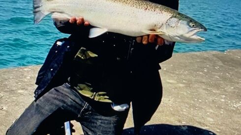 Jason “Special One” Le with a surprise brown fishing while coho fishing on the Chicago lakefront. Provided photo