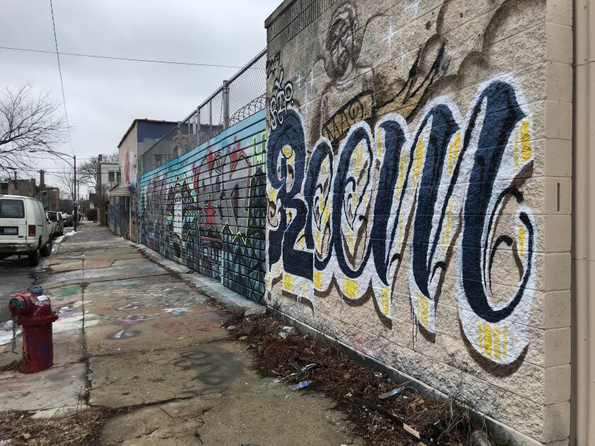 Near the intersection of North Milwaukee Avenue and West Medill Avenue, public art covers several buildings.