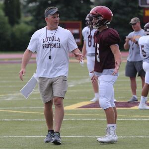 Loyola coach John Holocek talks to a player during practice.