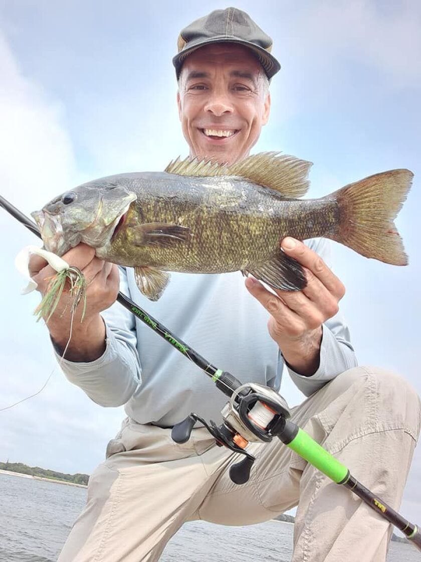 Rob Abouchar with a good smallmouth bass from shore at Heidecke Lake. Provided photo