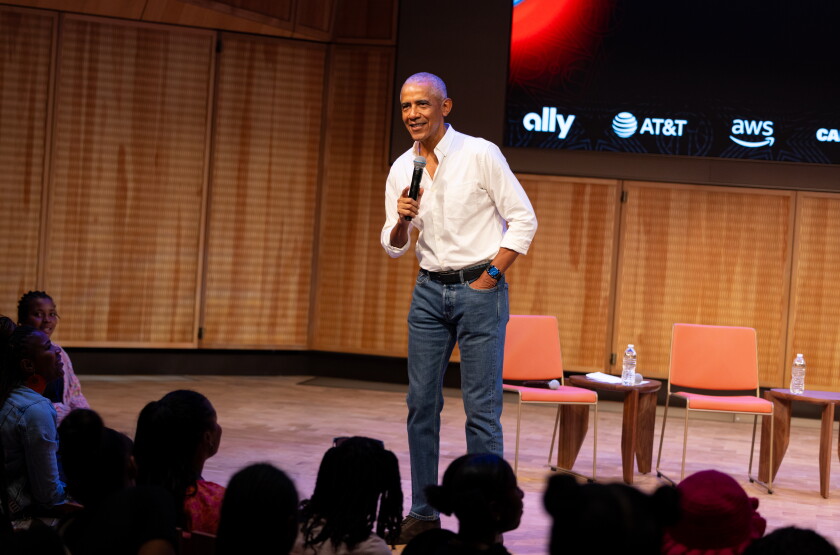 Former President Barak Obama surprises a group of high school freshman girls Friday during the WNBA Changemaker Day at the Obama Presidential Center in Jackson Park on the South Side.