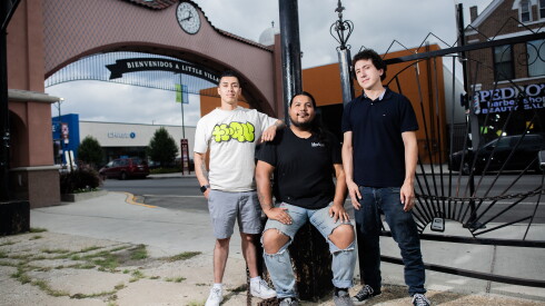 Daniel Silva, founder of Te-Qu, left, muralist Mr. Pintamuro, center, and Julio Anaya, smile at their new location.