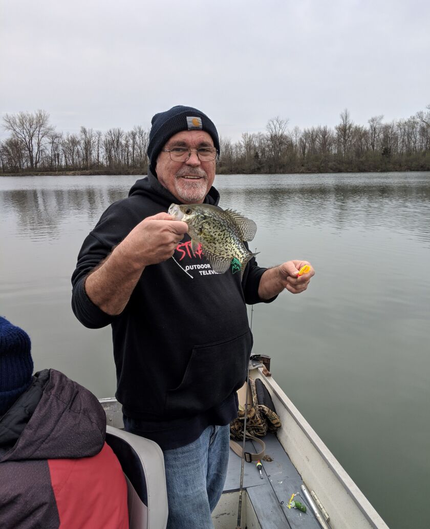 Dale Bowman with a lively crappie (before it met the fillet knife), caught in April of 2019 from an old clay pit. Credit: Dale Bowman