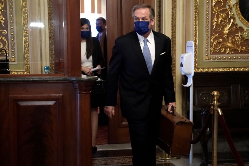 Michael van der Veen attorney for former President Donald Trump, heads to the Senate Chamber before the fifth day of the Senate Impeachment trials.