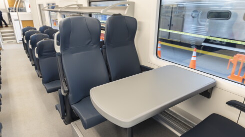 A seating area equipped with a table in a new battery-powered passenger train Metra plans to put in service. One of the trains was on display at LaSalle Street Station in the Loop on Oct. 14, 2026.