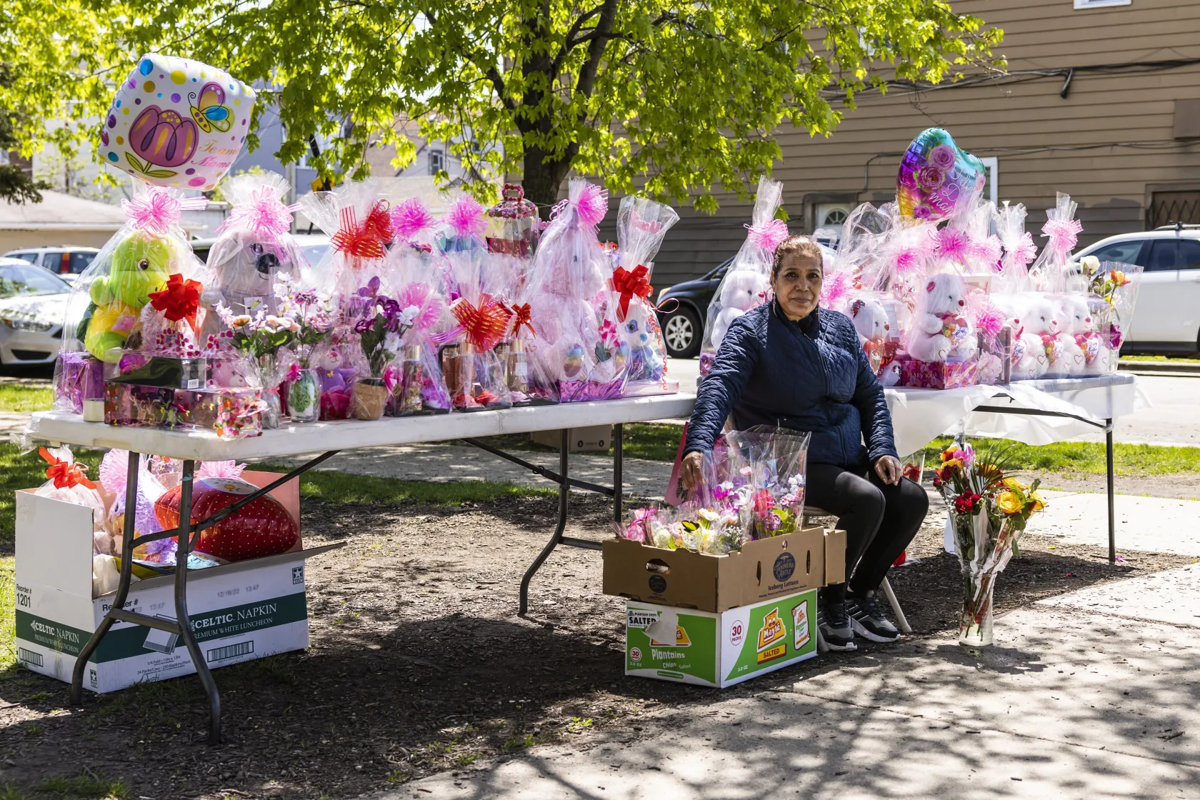 Beatriz Mora Martinez, 56, of Gage Park, sells Mother’s Day flower arrangements at a stand on South Kedzie Avenue near West 46th Street in Brighton Park, Tuesday, May 9, 2023.