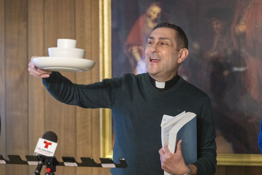 Emergency overnight shelter opens at former Oak Park Rectory of St. Catherine of Siena/St. Lucy Rectory Rev. Carl Morello, Vicar of St. Catherine of Siena /St. Lucy and St. Giles Parish displays unbroken plates and bowls donated for use at the emergency shelter Wednesday, Jan. 4, 2022 that is now open at the former rectory of St. Catherine of Siena/St. Lucy Parish.