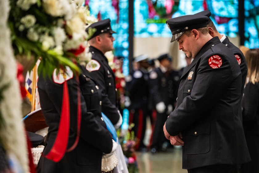 Supporters mourn fallen Chicago Firefighter Michael Altman during his visitation at St. Rita of Cascia Shrine Chapel, 7740 S. Western Ave., in the Ashburn neighborhood in Chicago on Thursday, March 26, 2026. Altman died after battling a Rogers Park apartment building fire earlier this month.