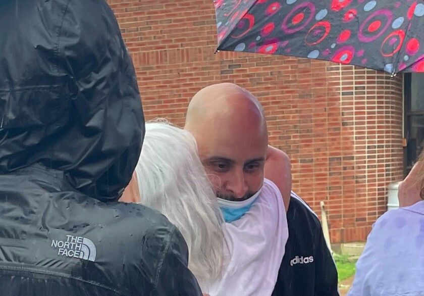Rosendo Hernandez hugs his mother Friday outside the Dixon Correctional Center after a judge overturned his conviction in a 1997 murder a day earlier.
