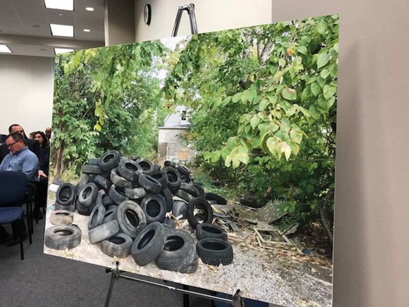 This picture of old tires that had been illegally dumped in a Chicago neighborhood was displayed at Tuesday’s committee meeting. The committee voted to hike fines for such “fly-dumping.” | Fran Spielman/Sun-Times