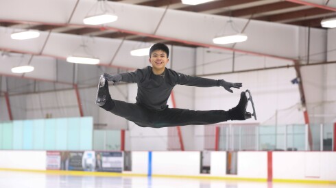 Lorenzo Elano performs a split jump during practice at Twin Rinks Ice Pavilion in Buffalo Grove in December.