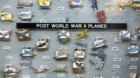 Pins of post World War II planes are on sale at Army Navy Sales in Lake View.