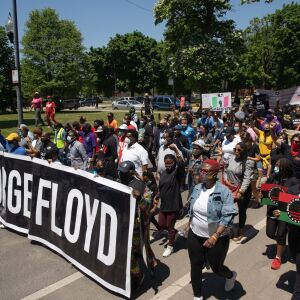 Protesters march down South Independence Boulevard in North Lawndale during the West Side interfaith peace march to demand police reform and equal opportunities for Black Americans on June 12, 2020. Protesters stopped at sites that Dr. Martin Luther King Jr. visited.