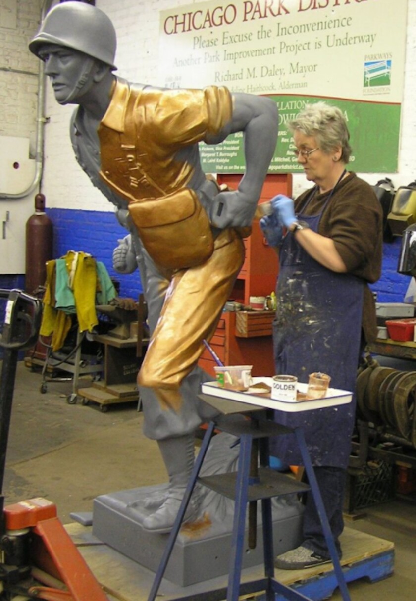 Jane Foley working on “The Spirit of the Fighting Yank” sculpture in Chicago.