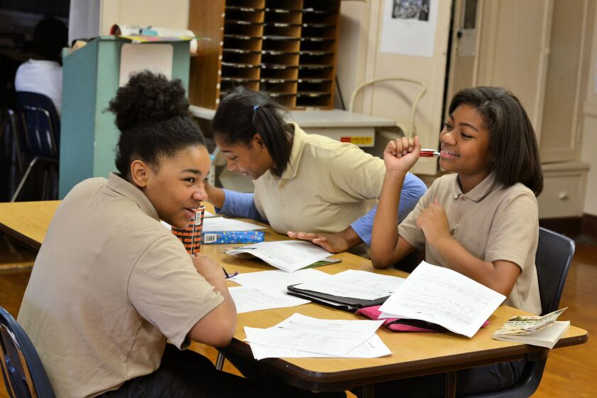 Eighth-graders at St. Catherine-St. Lucy placed third of 64 teams in a nine-month stock market program.