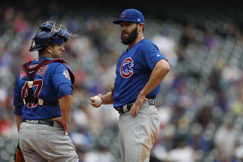 Jake Arrieta and Miguel Montero often worked well together during their time as a Cubs battery. The pitcher invited his former catcher out for a beer during Friday’s Cubs victory over Montego’s new team, the Blue Jays. (AP/David Zalubowski)
