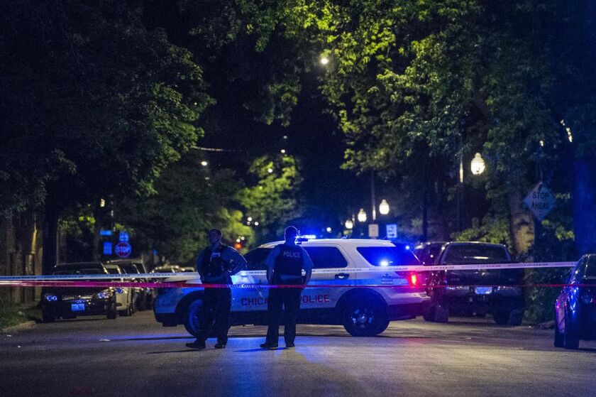 Police investigate a shooting that left one man dead and two others wounded early Tuesday in the 4000 block of West Fifth Avenue | Tyler LaRiviere/Sun-Times