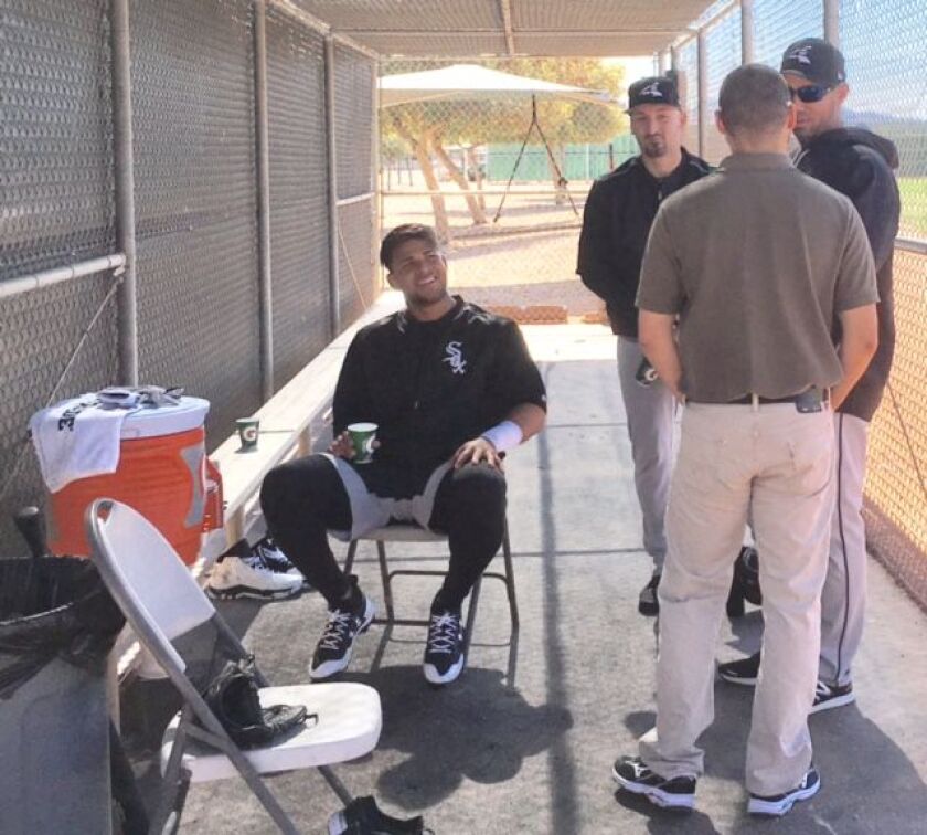 <em>Yoan Moncada catches a break during workouts Wednesday at Camelback Ranch. (Photo by Daryl Van Schouwen)</em>