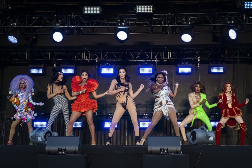 (From left) Crystal Methyd, Yvie Oddly, Vanessa Vanjie Mateo, Plastique Tiara, Asia O’Hara, Jaida Essence Hall and Gigi Goode perform together during Drive ‘N Drag presented by Voss Events at Soldier Field, Friday night, Aug. 7, 2020.