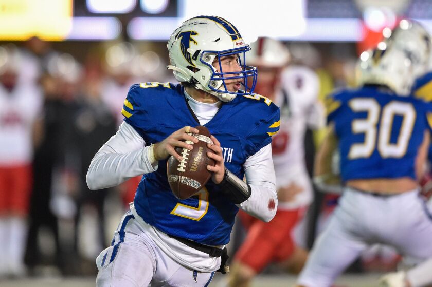 Wheaton North’s Mark Forcucci (5) gets ready to pass the ball against St. Rita.