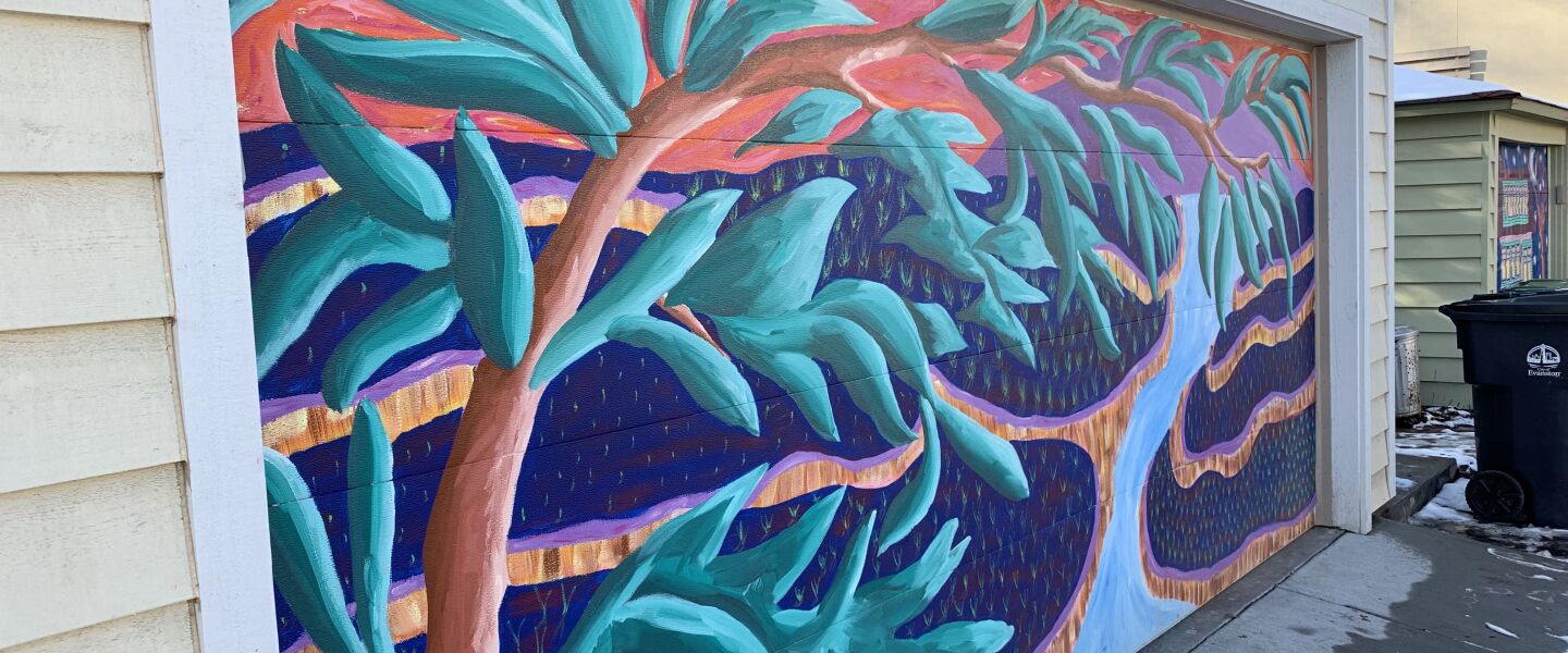 A garage-door mural of Bali, done by Teresa Parod, who studied Indonesian dance for years.