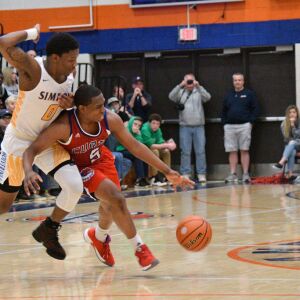 Simeon’s Kejuan Clements (0) fouls Curie’s Trevon Hamilton (5), Saturday 12-29-18. Worsom Robinson/For Sun-Times