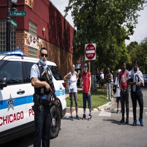Chicago police officers respond to reports of looting and rioting near West Monroe Street and South Pulaski Road on the West Side, Monday afternoon, Aug. 10, 2020.