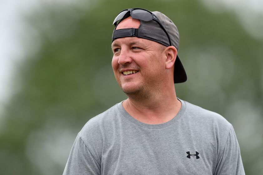 Joliet Catholic coach Jake Jaworski reacts during football practice.
