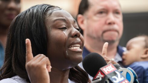 Shanee Edwards-Keller, a mother of a 5-month-old, speaks during a news conference Friday in the 7700 block of South Shore Drive — a week after another 5-month-old child was shot and killed in a drive-by shooting.