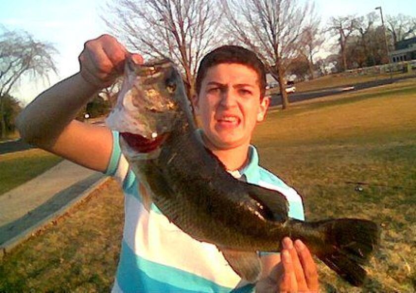 Andrew Narro with a 25-inch largemouth bass for Fish of the Week in March of 2009 while he was a young teen.<br>Credit: For the Sun-Times