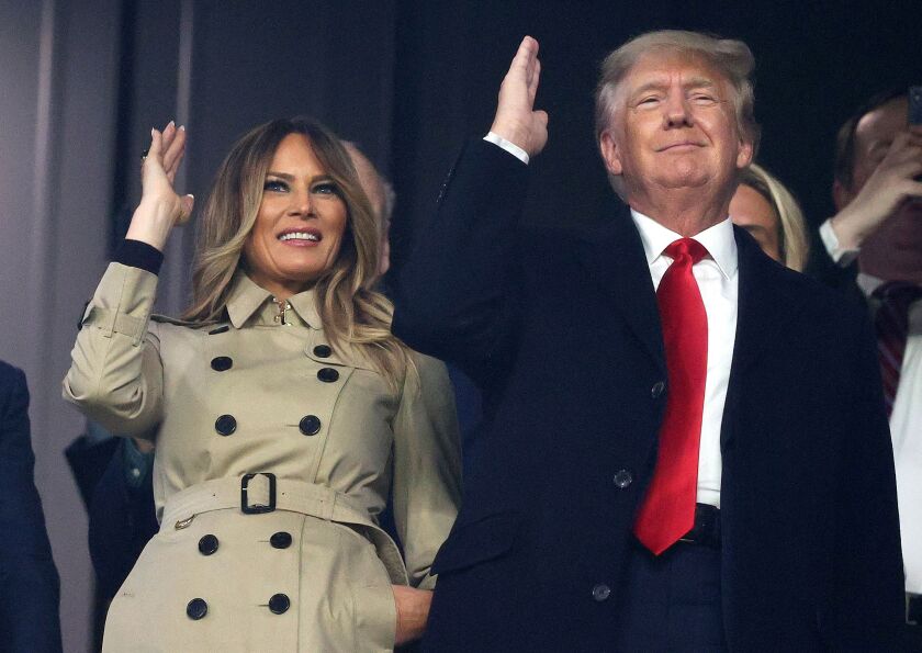 Former first lady and president of the United States Melania and Donald Trump do “the chop” prior to Game Four of the World Series between the Houston Astros and the Atlanta Braves Truist Park on October 30, 2021 in Atlanta, Georgia.