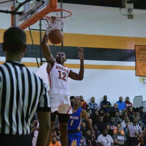 Bogan’s Rashaun Agee (12) goes up for a dunk. Worsom Robinson/For the Sun-Times.