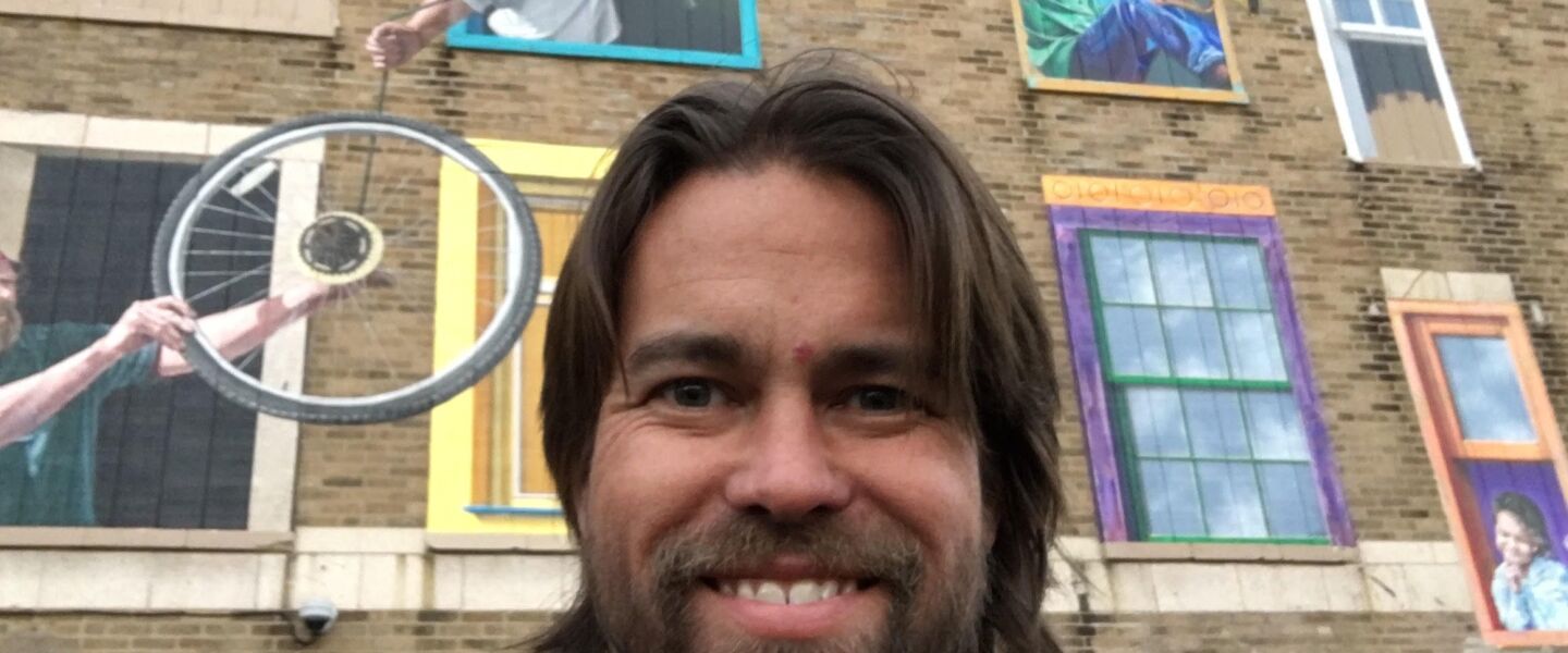 Chicago artist Matheu Bourque in front of the three-dimensional mural he painted at 1419 W. Howard St. in 2015 and 2016.