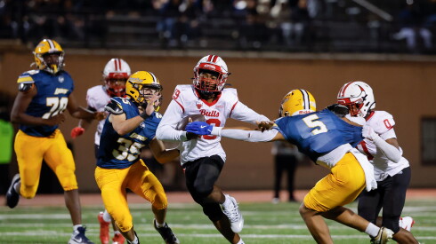 Bulls Prep’s Zylin Lewis (19) carries the ball against Lincoln Park at Lane Stadium.
