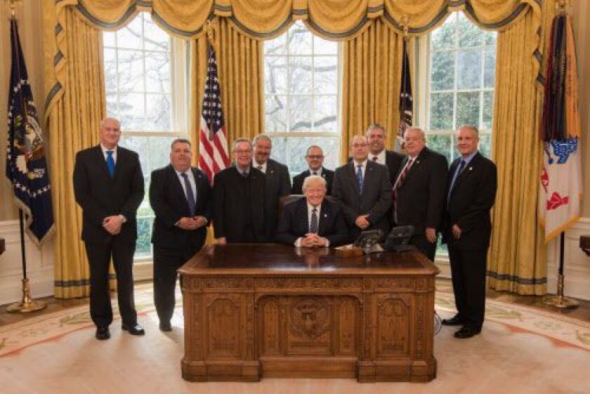 Dean Angelo and other Fraternal Order of Police representatives with President Donald Trump. Angelo is standing directly behind the president. | Provided photo
