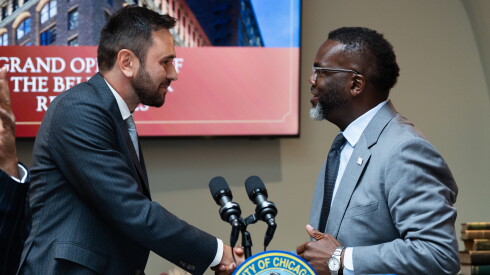 Giacomo Zanibelli, director of real estate at Lagfin S.C.A., shakes hands with Mayor Brandon Johnson during the grand opening of the Bellwether Residences in the Loop.