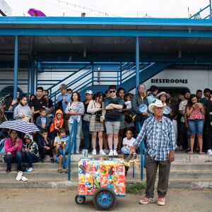 Spectators seek shelter from the rain while waiting for the show to resume during the Air and Water Show at North Avenue Beach, Saturday, Aug. 20, 2022. | Pat Nabong/Sun-Times