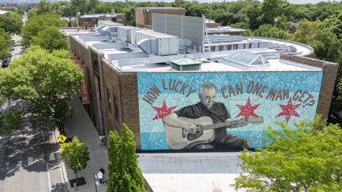 A mural depicting musician John Prine painted by Darius Dennis is on the north-facing wall of the Old Town School of Folk Music at 4544 N. Lincoln Ave. in Lincoln Square.