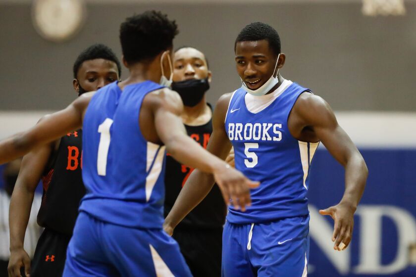 Brooks’ Tim Taiwo (5) reacts during the game against Bogan.