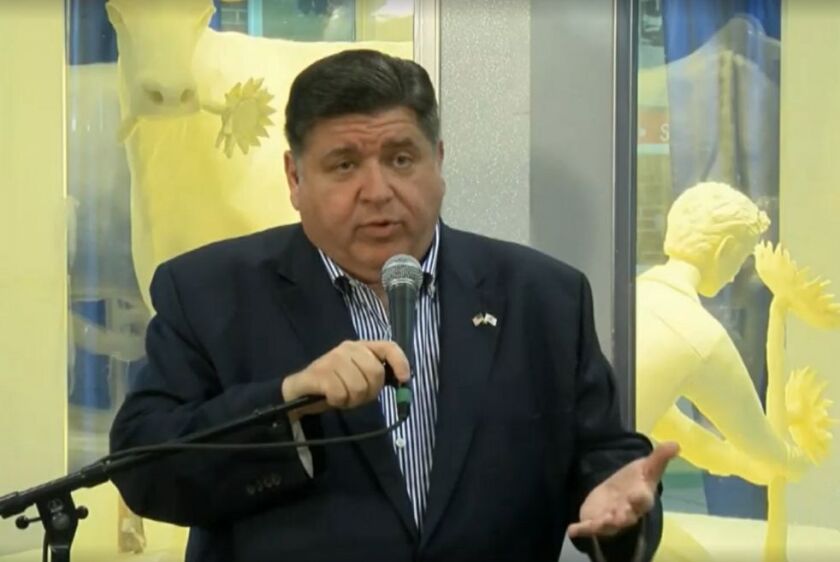 Gov. J.B. Pritzker talks to reporters on Wednesday.
