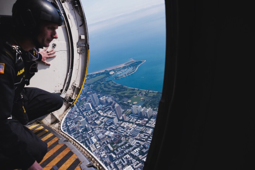 A member of the Golden Knights Black Demonstration Team looks out to the ground below from in the skies above Chicago for the Chicago Air and Water Show, Sunday, Aug. 17, 2025. | Anthony Vazquez/Sun-Times