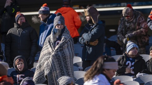 A Chicago Bears fan wears a blanket over her layers at December's game against the Cleveland Browns.