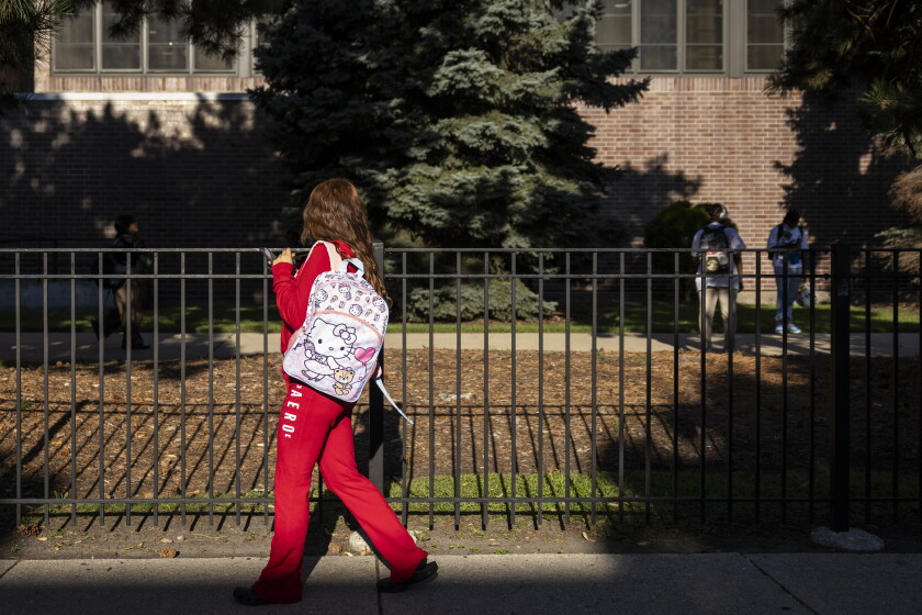 Students arrive at Prosser Career Academy on the first day of school in August. CPS dropped school ratings three years ago, but 10 of 44 candidates for school board would like the district to return to rating schools.