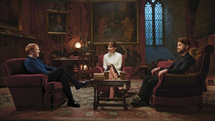 Three stars from the “Harry Potter” movies — Rupert Grint (from left), Emma Watson and Daniel Radcliffe — chat during a reunion special that begins streaming Jan. 1 on HBO Max.